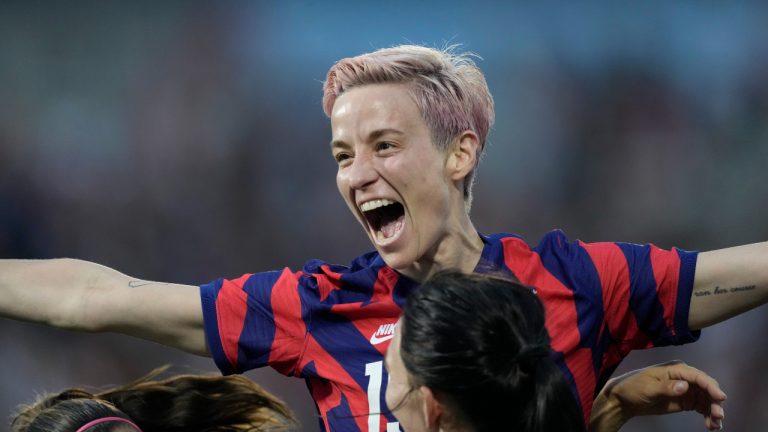 U.S. forward Megan Rapinoe, back, celebrates with midfielder Taylor Kornieck after Kornieck's goal against Colombia during the second half of an international friendly soccer match Saturday, June 25, 2022, in Commerce City, Colo. (AP)