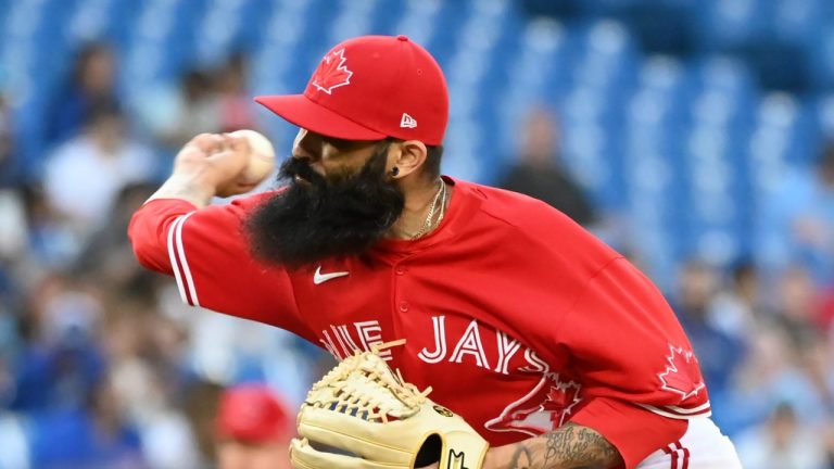 Toronto Blue Jays relief pitcher Sergio Romo throws to a Tampa Bay Rays batter in the seventh inning of the second game in doubleheader American League baseball action in Toronto, Saturday, July 2, 2022. (Jon Blacker/THE CANADIAN PRESS)