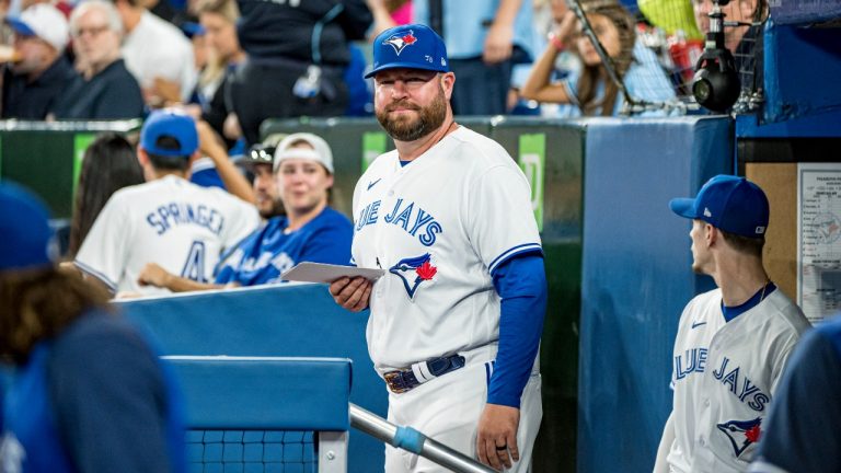 Interim manager John Schneider walks out of the Toronto Blue Jays dugout, before interleague MLB action against the Philadelphia Phillies in Toronto on Wednesday, July 13, 2022. (Christopher Katsarov/THE CANADIAN PRESS)