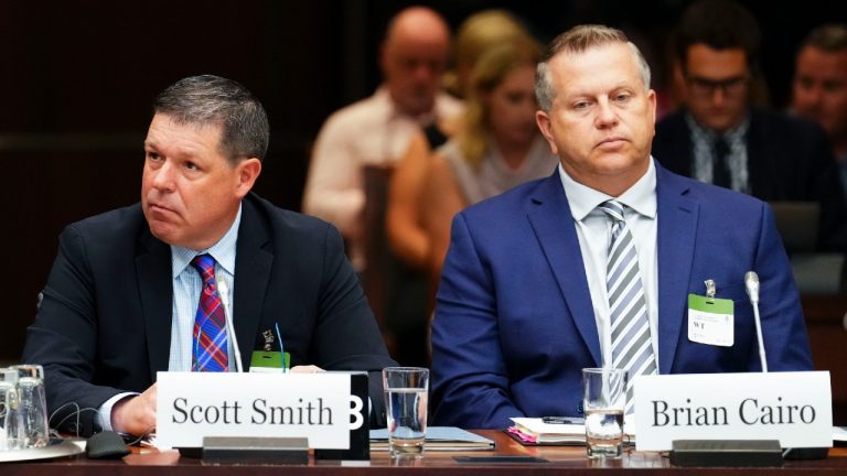 Witnesses Scott Smith, Hockey Canada President and Chief Operating Officer, left, and Hockey Canada Chief Financial Officer Brian Cairo, appear at the standing committee on Canadian Heritage in Ottawa on Wednesday, July 27, 2022, looking into how Hockey Canada handled allegations of sexual assault and a subsequent lawsuit. (Sean Kilpatrick/CP)