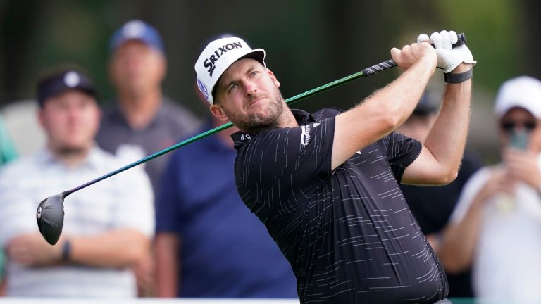 Taylor Pendrith drives off the 14th tee during the third round of the Rocket Mortgage Classic golf tournament, Saturday, July 30, 2022, in Detroit. (Carlos Osorio/AP)