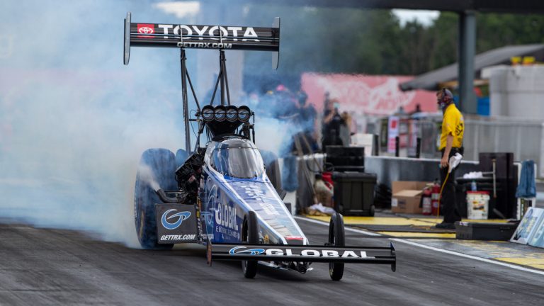 Tony Schumacher does a burnout in a Top Fuel practice run for an NHRA drag racing event in Brownsburg, Ind., Friday, July 10, 2020. (Michael Conroy/AP)