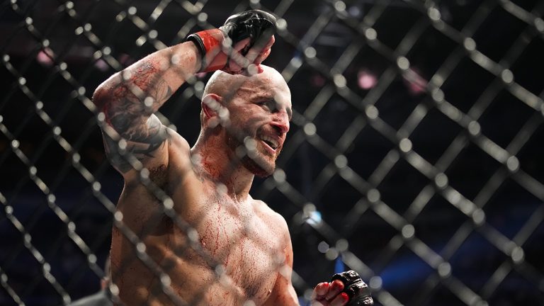 Alexander Volkanovski reacts after winning a featherweight title bout against Max Holloway during the UFC 276 mixed martial arts event Saturday, July 2, 2022, in Las Vegas. (John Locher/AP)