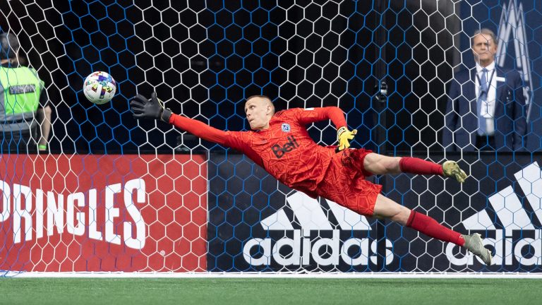 Vancouver Whitecaps goalkeeper Cody Cropper allows a goal to Minnesota United's Luis Amarilla, not shown, during the second half of an MLS soccer game in Vancouver, B.C., Friday, July 8, 2022. (Darryl Dyck/CP)