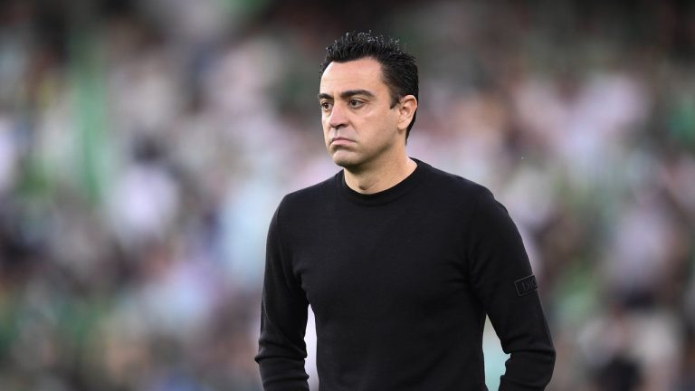 Barcelona's head coach Xavi Hernandez reacts during the Spanish La Liga soccer match between Real Betis and Barcelona at Benito Villamarin stadium in Seville, Spain, Saturday, May 7, 2022. Xavi has missed his team's flight for a preseason tour of the United States because of problems with his passport, the Spanish club said Saturday, July 16, 2022. (Jose Breton/AP, File)