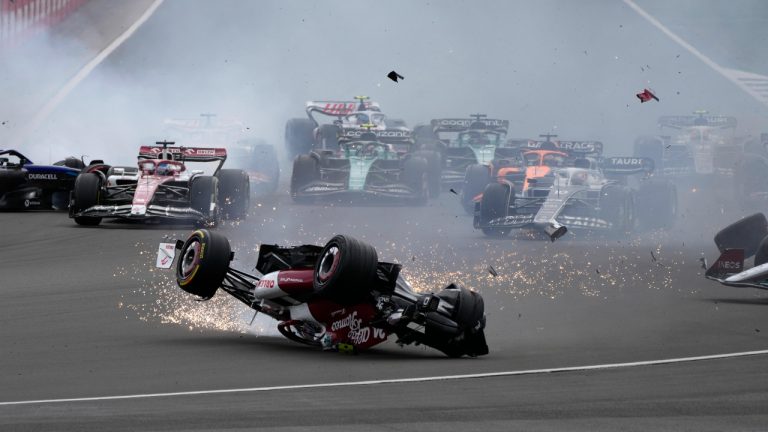 Alfa Romeo driver Guanyu Zhou of China crashes at the start of the British Formula One Grand Prix at the Silverstone circuit, in Silverstone, England, Sunday, July 3, 2022. (Frank Augstein/AP)