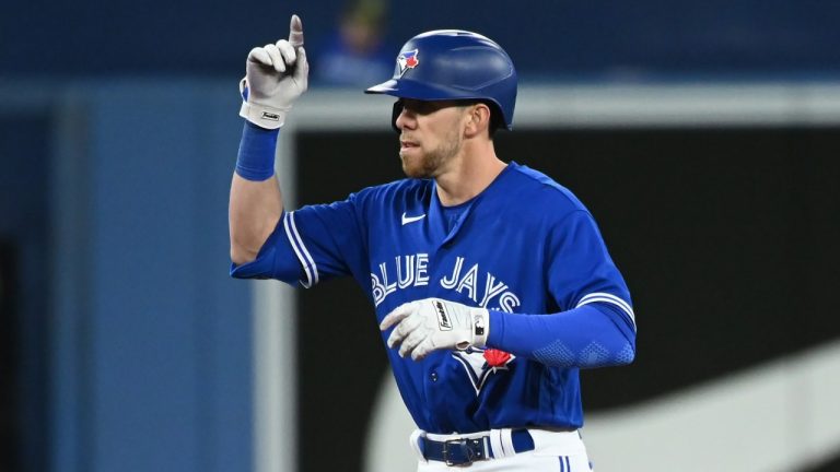 Toronto Blue Jays' Bradley Zimmer gestures toward the dugout after hitting a stand-up double in the fifth inning of an Interleague League baseball game against the Cincinnati Reds in Toronto on Friday, May 20, 2022. (Jon Blacker/THE CANADIAN PRESS)