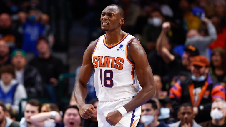 Phoenix Suns forward Bismack Biyombo celebrates after dunking during the second half of an NBA basketball game against the Dallas Mavericks, Thursday, Jan. 20, 2022, in Dallas. (Brandon Wade/AP)