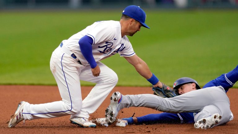 Toronto Blue Jays' Cavan Biggio, right, is caught stealing second by Kansas City Royals second baseman Whit Merrifield during the sixth inning of the second baseball game of a doubleheader. (Charlie Riedel/AP)