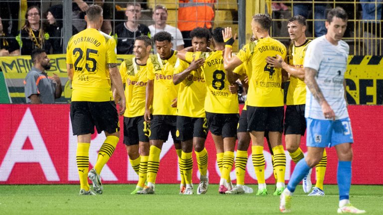 Borussia Dortmund players celebrate after scoring, during the German Soccer Cup 1st round match betwen 1860 Munich and Borussia Dortmund. (Matthias Balk/AP)