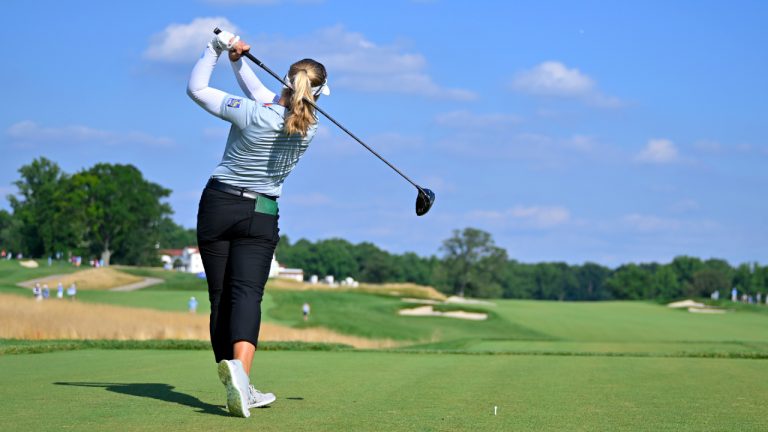 Brooke M. Henderson, of Canada, tees off on the ninth hole during the second round in the Women's PGA Championship golf tournament at Congressional Country Club, Friday, June 24, 2022, in Bethesda, Md. (Terrance Williams/AP) 