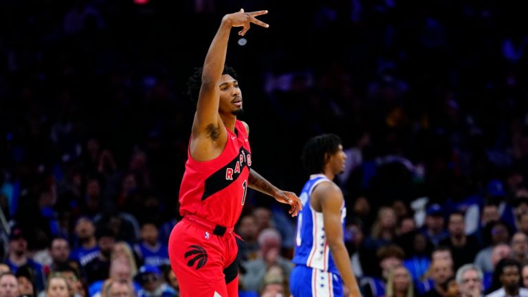 Toronto Raptors' Armoni Brooks, left, reacts after making a basket during the second half of an NBA basketball game against the Philadelphia 76ers, Sunday, March 20, 2022, in Philadelphia. (Matt Slocum/AP)