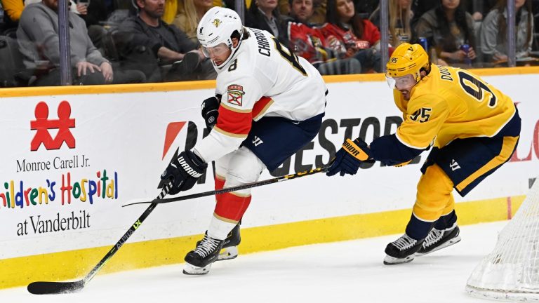 Florida Panthers defenseman Ben Chiarot (8) moves the puck in front of Nashville Predators center Matt Duchene (95) during the second period of an NHL hockey game Saturday, April 9, 2022, in Nashville, Tenn. (Mark Zaleski/AP)