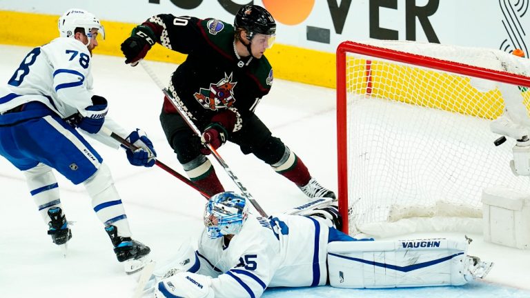 Arizona Coyotes center Ryan Dzingel (10) beats Toronto Maple Leafs goaltender Petr Mrazek, right, for a goal as Maple Leafs defenseman TJ Brodie (78) arrives late to help during the third period of an NHL hockey game Wednesday, Jan. 12, 2022, in Glendale, Ariz. (Ross D. Franklin/AP)