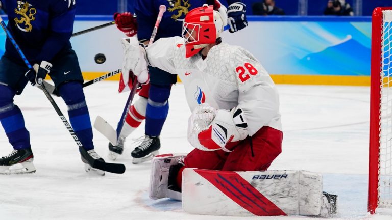 Russian Olympic Committee goalkeeper Ivan Fedotov (28) blocks a shot as Finland's Teemu Hartikainen (70) and Iiro Pakarinen (81) watch for the rebound during the men's gold medal hockey game at the 2022 Winter Olympics, Sunday, Feb. 20, 2022, in Beijing. (Matt Slocum/AP)