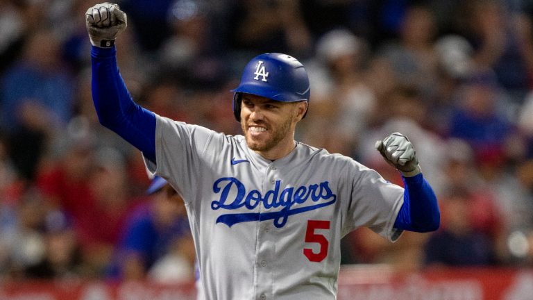 Los Angeles Dodgers' Freddie Freeman reacts to his friends and family in the stands after hitting a solo home run against the Los Angeles Angels during the fifth inning of a baseball game in Anaheim, Calif., Saturday, July 16, 2022. (Alex Gallardo/AP) 