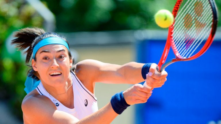 France's Caroline Garcia, returns to Croatia's Petra Martic, during their semi final match at the WTA International Ladies Open Lausanne tennis tournament, in Lausanne, Switzerland, Saturday, July 16, 2022. (Laurent Gillieron/Keystone via AP)