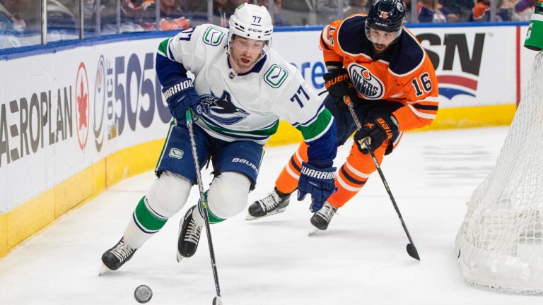 Vancouver Canucks' Brad Hunt (77) is chased by Edmonton Oilers' Derick Brassard (16) during second period NHL action in Edmonton, Friday, April 29, 2022. (Jason Franson/CP)