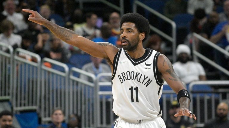 Brooklyn Nets guard Kyrie Irving (11) acknowledges a teammate after scoring a 3-pointer during the first half of an NBA basketball game against the Orlando Magic, Tuesday, March 15, 2022, in Orlando, Fla. (Phelan M. Ebenhack/AP)