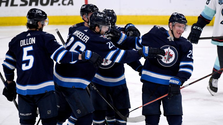 Winnipeg Jets' Paul Stastny (25) celebrates his 800th career point with an assist on Blake Wheeler’s (26) goal against the Seattle Kraken during the third period of NHL action in Winnipeg on Sunday May 1, 2022. (Fred Greenslade/CP)