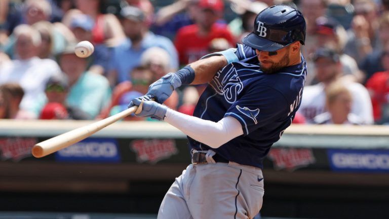 Tampa Bay Rays' Kevin Kiermaier hits a single during the fifth inning of a baseball game against the Tampa Bay Rays, Sunday, June 12, 2022, in Minneapolis. (Stacy Bengs/AP)