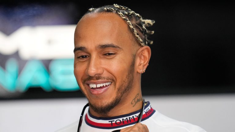 Mercedes driver Lewis Hamilton, of Britain, smiles at pit prior to the start of the first practice for the French Formula One Grand Prix at Paul Ricard racetrack in Le Castellet, southern France, Friday, July 22, 2022. (Manu Fernandez/AP)