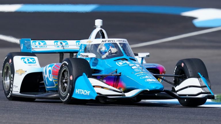 Josef Newgarden drives into a turn during a practice session for a IndyCar auto race at Indianapolis Motor Speedway, Friday, July 29, 2022, in Indianapolis. (Darron Cummings/AP)