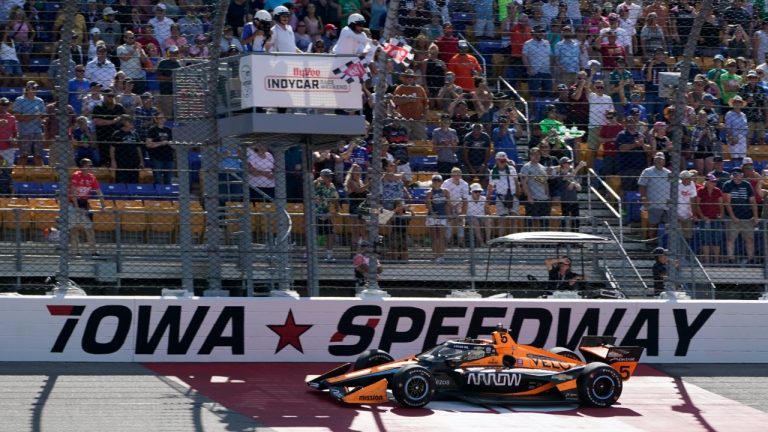 Pato O'Ward, of Mexico, crosses the finish line as he wins an IndyCar Series auto race, Sunday, July 24, 2022, at Iowa Speedway in Newton, Iowa. (Charlie Neibergall/AP)