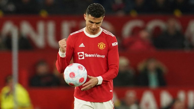 Manchester United's Cristiano Ronaldo holds the ball after Chelsea's Marcos Alonso scored his side's first goal during the English Premier League soccer match between Manchester United and Chelsea, at Old Trafford Stadium, Manchester, England, Thursday, April, 2022. (Dave Thompson/AP)