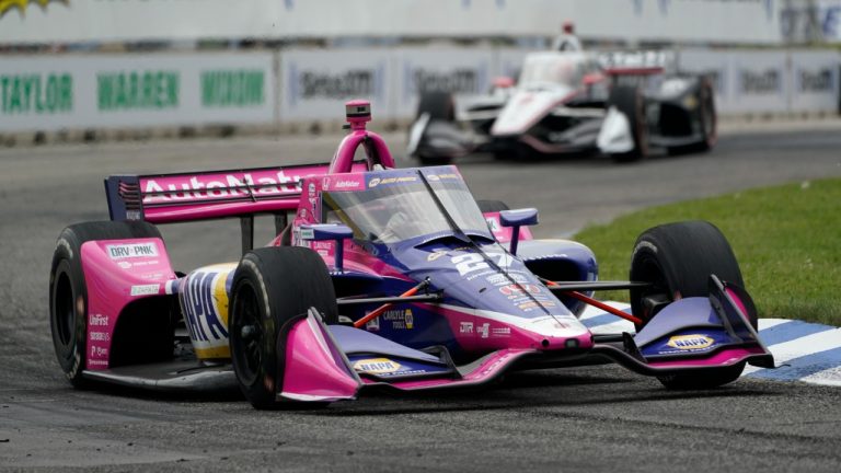 Alexander Rossi (27) races during the IndyCar Detroit Grand Prix auto race on Belle Isle in Detroit, Sunday, June 5, 2022. (Paul Sancya/AP)