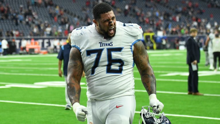 Tennessee Titans guard Rodger Saffold (76) celebrates with fans after their win over the Houston Texans in an NFL football game, Sunday, Jan. 9, 2022, in Houston. (Justin Rex/AP)