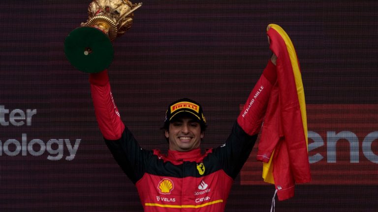 Ferrari driver Carlos Sainz of Spain celebrates on the podium after winning the British Formula One Grand Prix at the Silverstone circuit, in Silverstone, England, Sunday, July 3, 2022. (Matt Dunham/AP)