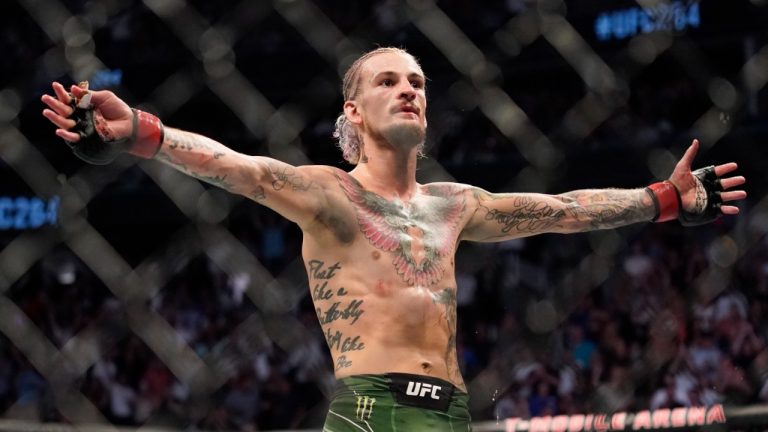 Sean O'Malley celebrates during his bantamweight mixed martial arts bout against Kris Moutinho at UFC 264 on July 10 in Las Vegas. (John Locher/AP)