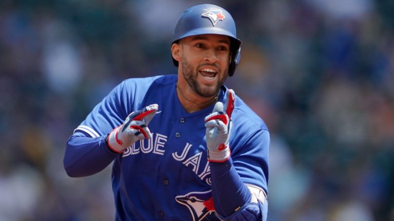 Toronto Blue Jays' George Springer reacts as he rounds the bases after hitting a solo home run during the first inning of a baseball game against the Seattle Mariners, Sunday, July 10, 2022, in Seattle. (Ted S. Warren/AP)