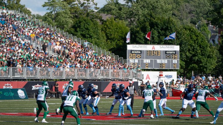 The Toronto Argonauts and the Saskatchewan Roughriders play at the line of scrimmage during the second half of CFL action at Acadia University in Wolfville, N.S., Saturday, July 16, 2022. (Darren Calabrese/CP)