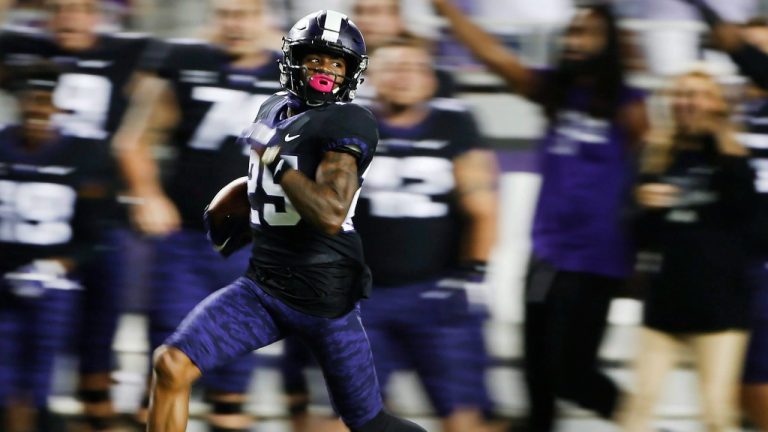 TCU's KaVontae Turpin returns a punt 90 yards for a touchdown as Kansas' Chase Harrell (3) during the second half of an NCAA college football game Saturday, Oct. 21, 2017, in Fort Worth, Texas. TCU won 43-0. (Ron Jenkins/AP)