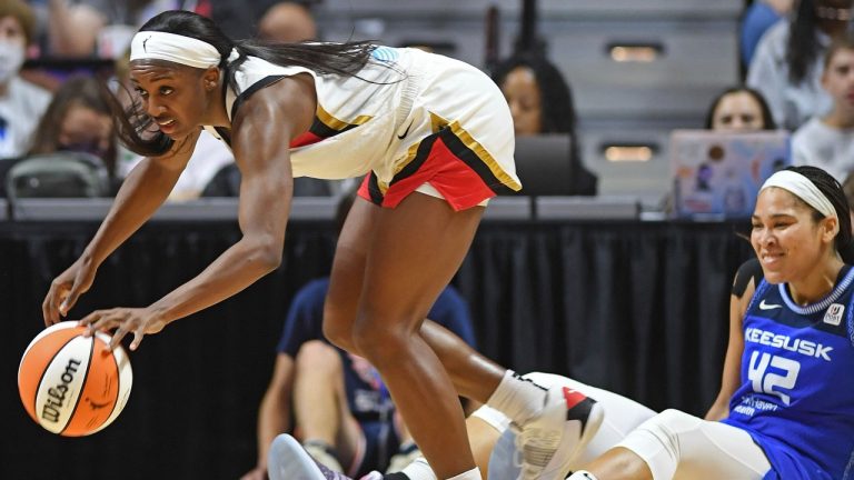 Las Vegas Aces guard Jackie Young (0) takes the ball away from Connecticut Sun centre Brionna Jones (42) during a WNBA basketball game, Sunday, July 17, 2022, in Uncasville, Conn. (Sean D. Elliot/AP)