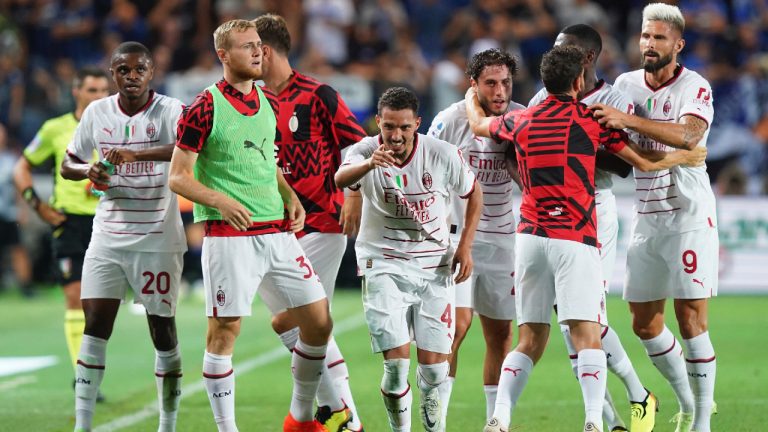 Ismael Bennacer of Milan, center, and his teammates celebrate after he scored goal 1-1 during the Italian Serie A soccer match between Atalanta and AC Milan at the Gewiss Stadium, Bergamo, Italy, Sunday, Aug. 21, 2022. (Spada/LaPresse via AP)