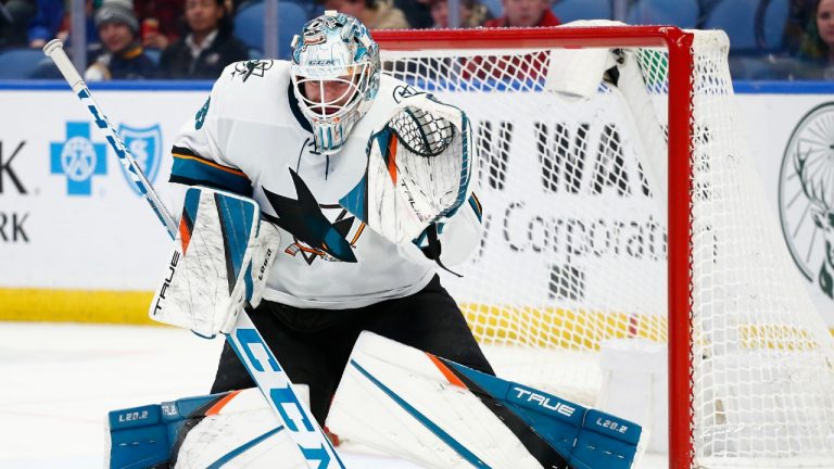 San Jose Sharks goaltender Adin Hill (33) makes a save during the first period of an NHL hockey game against the Buffalo Sabres, Thursday, Jan. 6, 2022, in Buffalo, N.Y. (Jeffrey T. Barnes/AP)