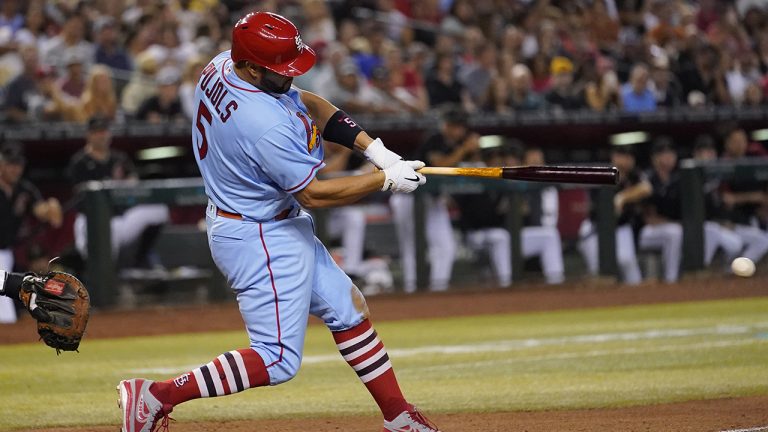 St. Louis Cardinals' Albert Pujols connects for a base hit against the Arizona Diamondbacks during the seventh inning of a baseball game, Saturday, Aug. 20, 2022, in Phoenix. (Matt York/AP)