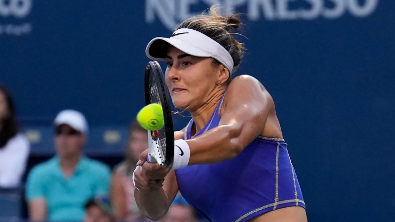 Bianca Andreescu, of Canada, returns the ball against Qinwen Zheng, of China, during the National Bank Open tennis tournament in Toronto on Thursday, August 11, 2022. (Nathan Denette/CP)