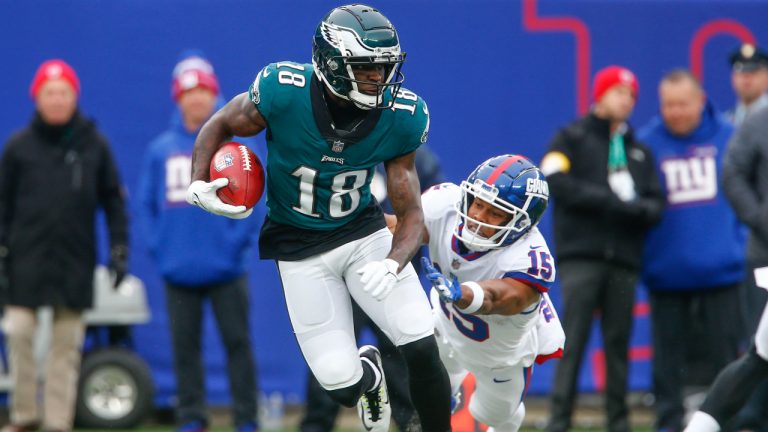 Philadelphia Eagles' Jalen Reagor, left, evades New York Giants' Collin Johnson during the first half of an NFL football game, Sunday, Nov. 28, 2021, in East Rutherford, N.J. (AP Photo/John Munson)