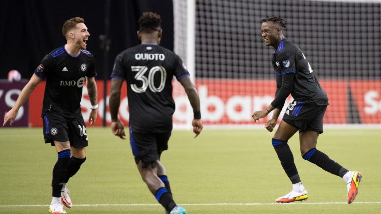 CF Montreal's Ismael Kone, right, celebrates with teammates after scoring against Santos Laguna during the second half of the second leg of their 2022 CONCACAF Champions League soccer game in Montreal, Wednesday, February 23, 2022. THE CANADIAN PRESS/Graham Hughes