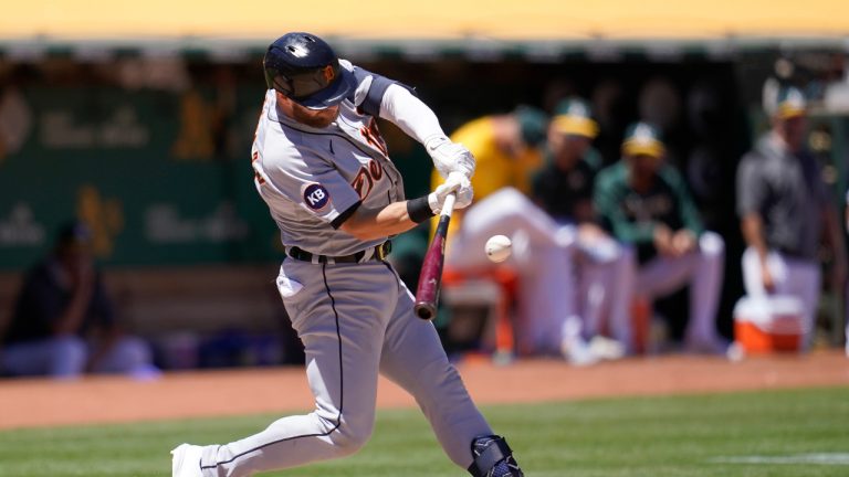 Detroit Tigers' Robbie Grossman hits an RBI double against the Oakland Athletics during the fifth inning of the first baseball game of a doubleheader in Oakland, Calif., Thursday, July 21, 2022. (AP Photo/Jeff Chiu)