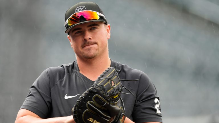 Chicago White Sox catcher Reese McGuire warms up before a baseball game against the Colorado Rockies Tuesday, July 26, 2022, in Denver. (AP Photo/David Zalubowski)