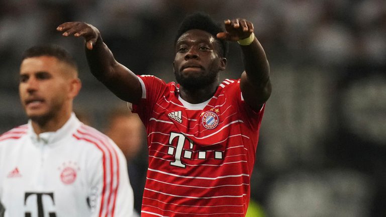 Bayern's Alphonso Davies, right, celebrates after the German Bundesliga soccer match between Eintracht Frankfurt and Bayern Munich in Frankfurt, Germany, Friday, Aug. 5, 2022. (Matthias Schrader/AP)