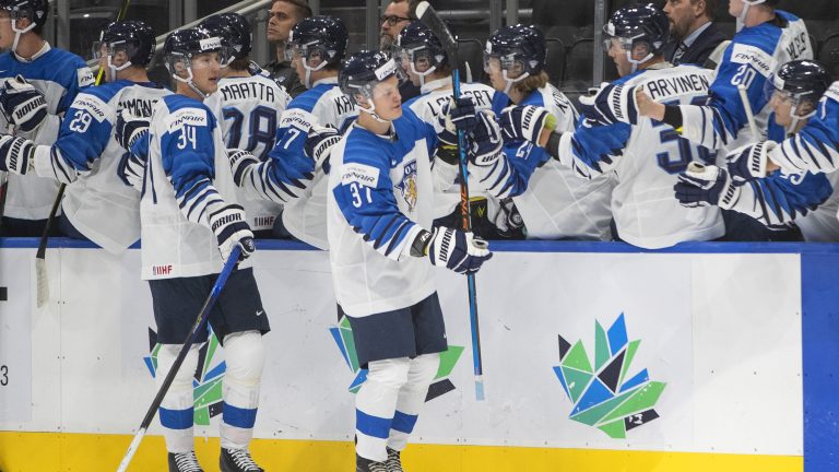 Finland's Aatu Raty (34) and Joakim Kemell (37) celebrate a goal against Latvia during first period IIHF World Junior Hockey Championship action in Edmonton on Tuesday, August 9, 2022. (Jason Franson/CP)