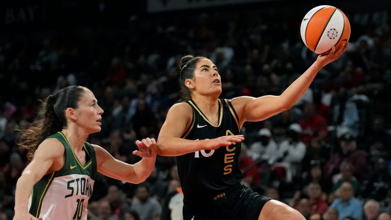 Las Vegas Aces guard Kelsey Plum shoots around Seattle Storm guard Sue Bird during the first half in Game 1 of a WNBA basketball semifinal playoff series. (John Locher/AP)