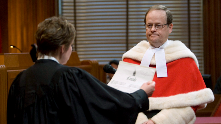 Justice Thomas Cromwell is sworn in by deputy registrat Louise Meagher during a public ceremony at the Supreme Court of Canada in Ottawa, Monday Feb. 16, 2009. Cromwell was officially sworn in as a Justice during a private ceremony in January. (CP)