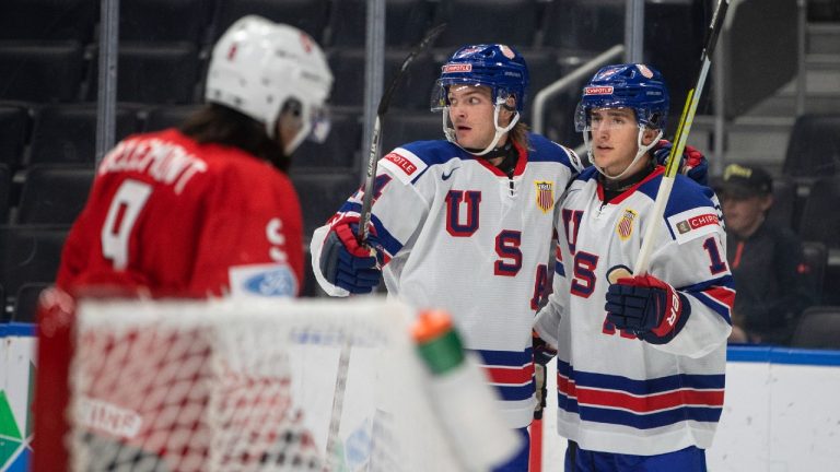 USA's Mackie Samoskevich (11) and Carter Mazur (34) celebrate a goal against Switzerland during second period IIHF World Junior Hockey Championship action in Edmonton on Thursday August 11, 2022. (Jason Franson/CP)